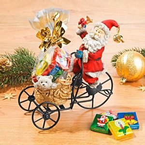 Moș Crăciun pe o tricicletă imagine