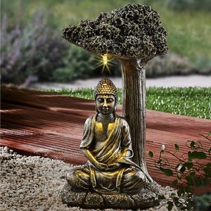Buddha așezat sub un copac imagine