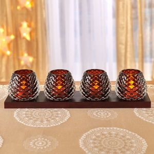 4 suporturi pentru lumânări pe o tavă imagine